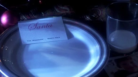 Crumbs falling onto plate with Santa's calling card Video stock 8573351