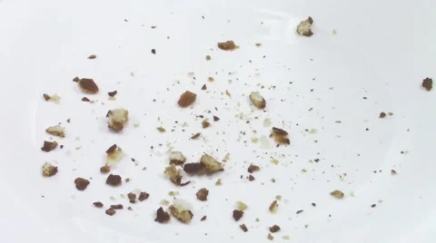 Crumbs falling on white plate 스톡 동영상 47808676