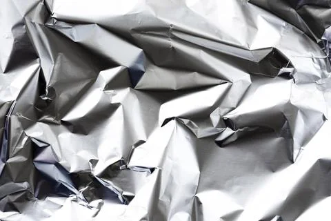 Crumpled aluminium foil background Stock Photos