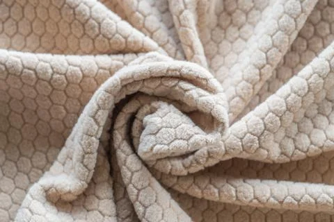 Crumpled beige fabric with hexagonal pattern Stock Photos