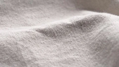 Crumpled beige linen fabric texture with organic weave pattern Stock Footage 334872512