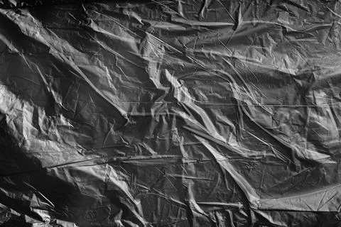 Crumpled Black Plastic Background Stock Photos