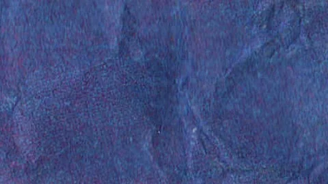 Crumpled blue paper texture in blurred stop motion animation, Porous speckl.. Video stock 330551223