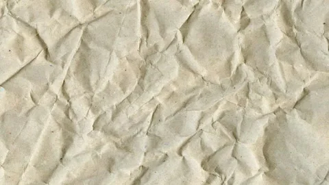 Crumpled brown craft paper texture background, animated background Video stock 333977598