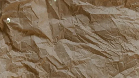 Crumpled brown kraft paper texture background, animated background Video stock 333977594