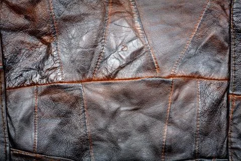 Crumpled brown leather patchwork Stock Photos