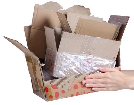 Crumpled brown packing cardboard boxes in hand Stock Photos
