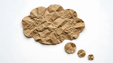 Crumpled brown paper speech bubble on white background for creative thinkin.. 스톡 사진