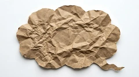 Crumpled brown paper speech bubble cutout on a white background for creativ.. Stock Photos