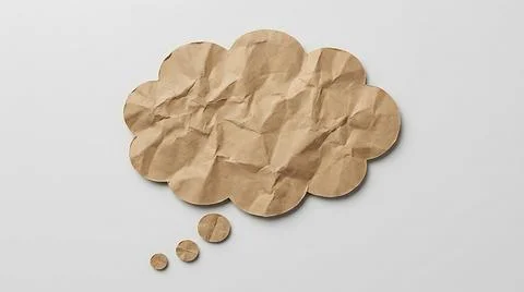 Crumpled brown paper speech bubble on a white background for creative commu.. Stock Photos
