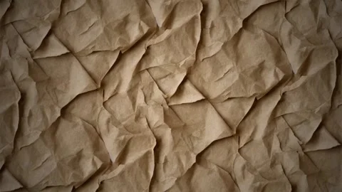 Crumpled brown paper texture background, with subtle light movement 스톡 동영상 341603653