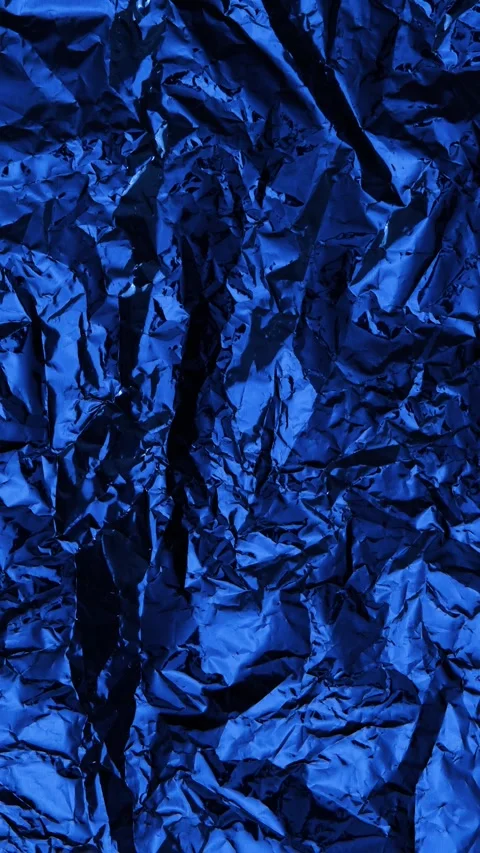 Crumpled Dark Blue Foil Texture Background with Metallic Shine Stop Motion Stock Footage 311501636
