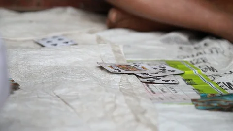 Crumpled Deck of Cards are Tossed on a Dingy Mat Stock Footage 129109502