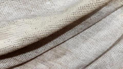 Crumpled dirty burlap. Vintage background. Coarse pleated fabric Stock Photos