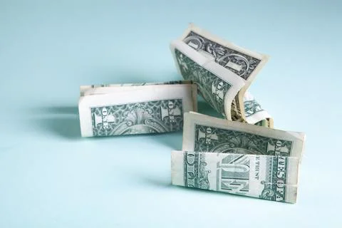Crumpled dollar bills on the table Stock Photos