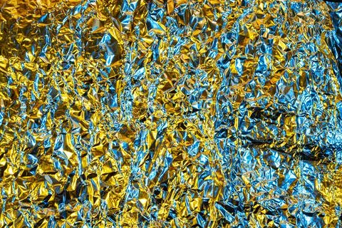 Crumpled foil background Stock Photos