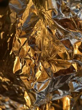 Crumpled foil close-up macro Stock Photos