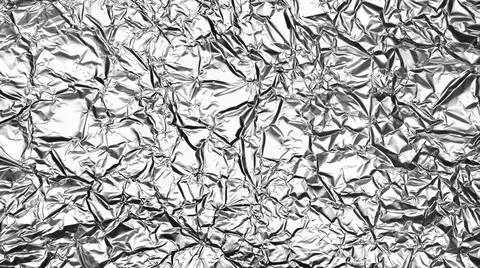Crumpled foil sheet background texture , silver aluminum foil as background f Stock Photos