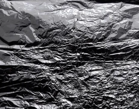 Crumpled foil. Texture. Gray background Stock Photos