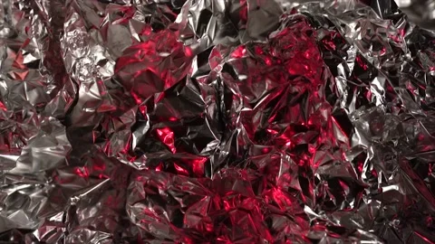 Crumpled foil texture with red lights, metallic shiny texture Stock Footage 232764013