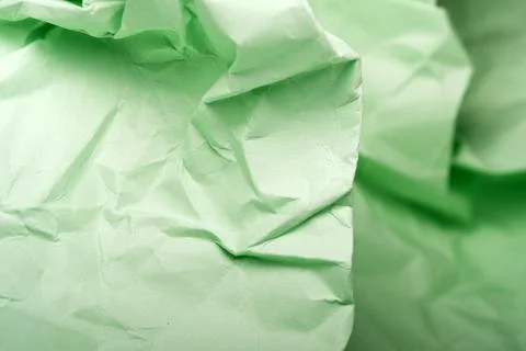 Crumpled green paper with abstract patterns 스톡 사진