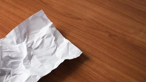 Crumpled paper action desk setting still life minimalist environment close-.. Stock Photos