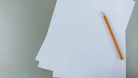 Crumpled paper balls falls on the table near white paper sheets and pencil. Stock Footage 113994508