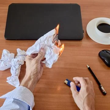 Crumpled paper burning Stock Photos