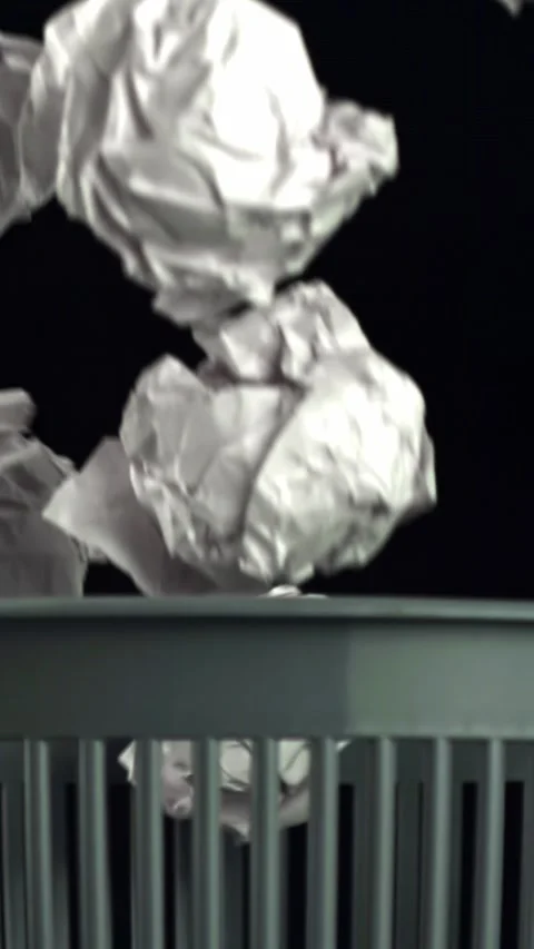 Crumpled paper falls into the trash can. Filmed on a high-speed camera at 1000 Stock Footage 335366308
