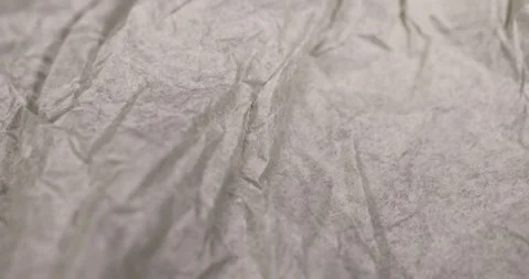 Crumpled paper for packaging , part of a sheet of paper crumpled after use Stock Footage 312415642