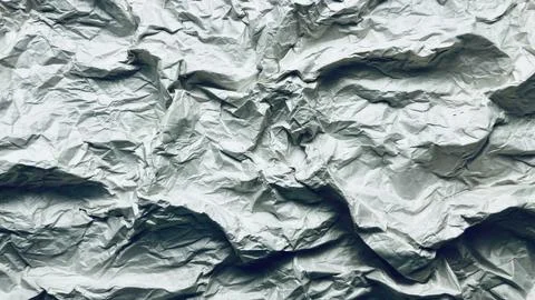 Crumpled paper texture abstract background with intricate wrinkles folds an.. Stock Photos