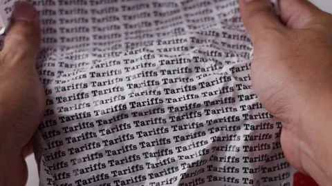 Crumpled paper with words Tariffs with Made in USA and China. Stock Footage 306594481