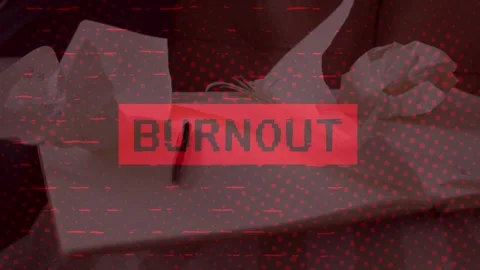 Crumpled Papers on Desk with Red BURNOUT Glitch Text Concept Stock Footage 336478712