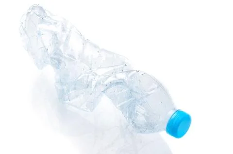 Crumpled PET plastic bottle of drinking water on white background Stock Photos