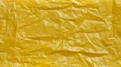 Crumpled Plastic Bag Texture, Yellow Creased Plastic Sheet, Abstract Shapes f Foto stock