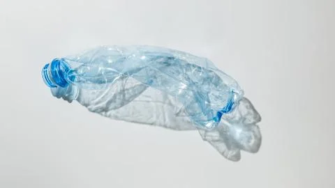 Crumpled plastic bottle. Grey isolate Stock Photos
