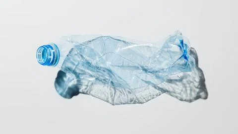 Crumpled plastic bottle on a light background Stock Photos