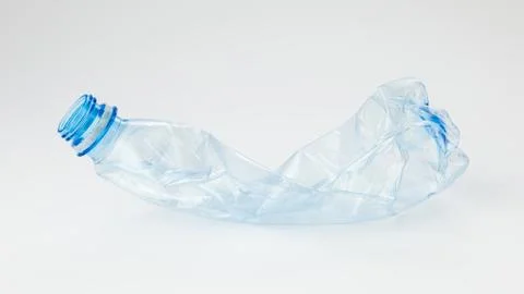 Crumpled plastic bottle on a light background Stock Photos
