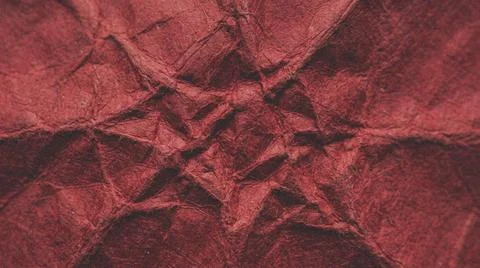 Crumpled red paper texture background closeup. Fotos Stock