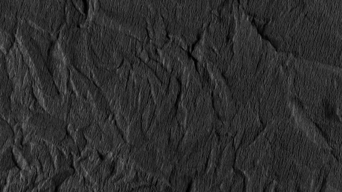 Crumpled rough dark surface. Seamless loop background. Stock Footage 255359573