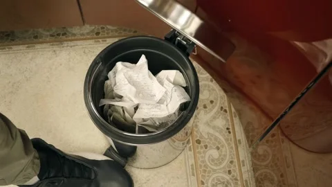 Crumpled sheet of paper that turned out to be unnecessary flies into a trash can Stock Footage 303300347