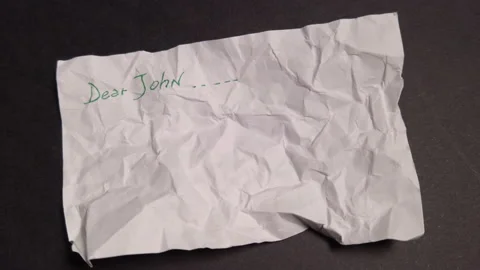 Crumpled sheet of paper with the words dear Stock Footage 227595706