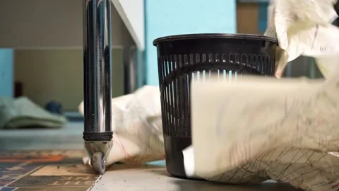 Crumpled sheets of paper fall into trash basket in workshop closeup Stock Footage 273531899