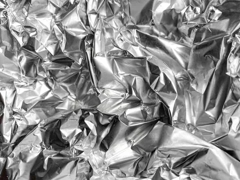 	Crumpled silver foil texture. Foto stock