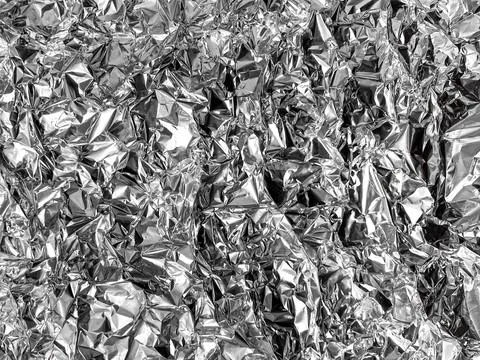 Crumpled silver foil texture. Foto stock