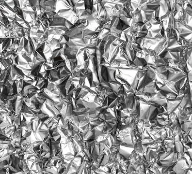 Crumpled silver foil texture. Foto stock