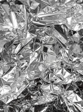 Crumpled silver foil texture. Foto stock
