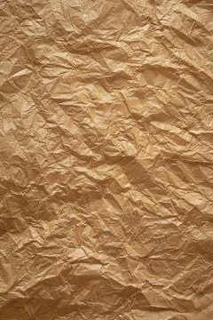 Crumpled thin brown paper background texture Stock Photos