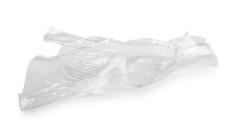 Crumpled transparent candy wrapper on white background Stock Photos
