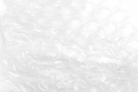 Crumpled white bubble wrap plastic sheet with light abstract texture.  Stock Photos